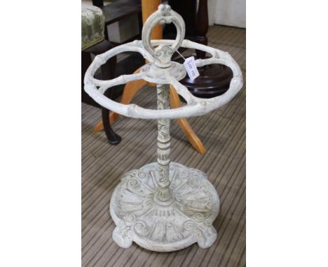 A DECORATIVELY PAINTED CAST METAL STICK STAND 