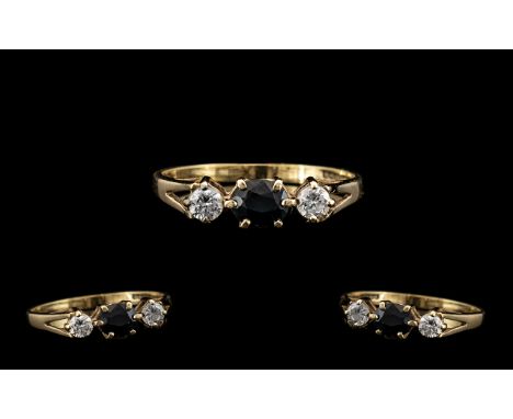 9ct Gold Attractive 3 Stone Diamond &amp; Sapphire Set Dress Ring.  Full hallmark for 9.375.  The two round-cut diamonds of e