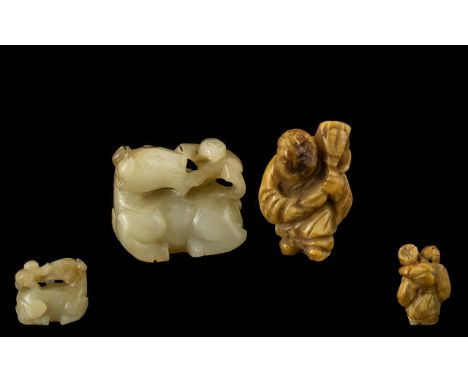 Chinese 18th / 19th Century Celadon Jade Sculpture of a Small Figure on the back of a Large Beast Pulling at Its Head. 1.3/8 