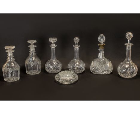 Collection of Six Cut Glass Decanters comprising two matching decanters with a diamond cut design; three matching decanters o