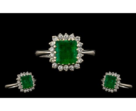 18ct White Gold Nice Quality and Attractive Emerald and Diamond Cluster Ring - flower head setting. Marked 18ct 750. The cent