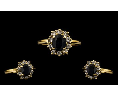 18 CT Gold Attractive Diamond &amp; Sapphire Set Cluster Ring Flowerhead setting. The central sapphire surrounded by 12 round