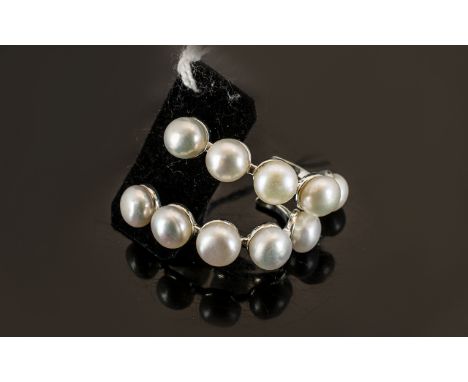 White Fresh Water Pearl J-Hoop Earrings, each earring having five natural white, fresh water button pearls set down the front