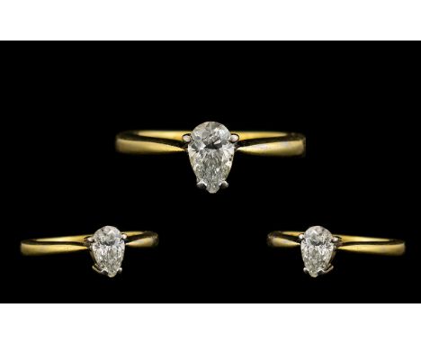 18ct Gold Superior Quality Single Pear Shaped Diamond Set Dress Ring the faceted pear shaped diamond of excellent colour and 