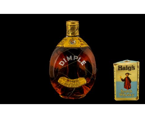 A Vintage Haig's Scotch Dimple Whisky Bottle, seals intact and with original packaging. 