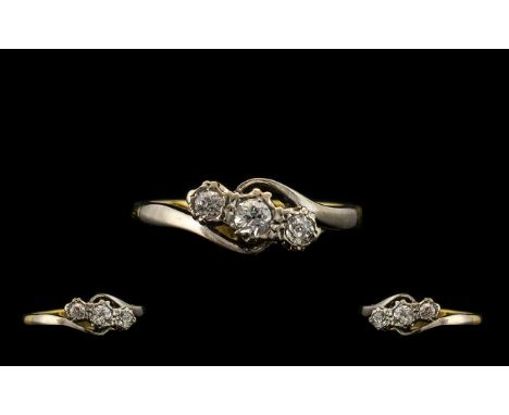 18ct Three Stone Diamond Ring set with three round cut diamonds on a twist, fully hallmarked. Ring size M.