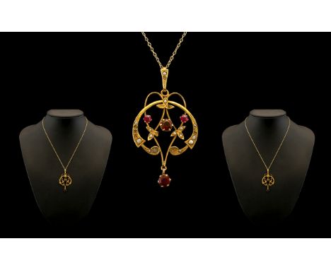 Art Nouveau 9ct Gold Garnet and Seed Pearl Set Pendant with drop attached to a 9ct gold chain. Both marked for 9ct. Chain len