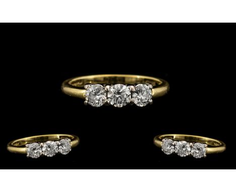 18ct Gold Attractive 3 Stone Diamond Set Ring fully hallmarked for 18ct - 750. The three round cut brilliant diamonds of exce