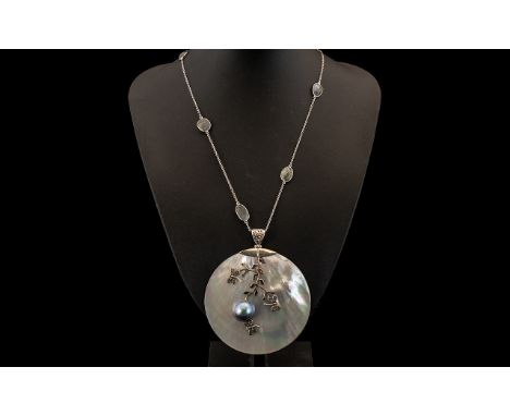 Mother of Pearl, Mabe Pearl and Labradorite Pendant Necklace, a large white mother of pearl circular pendant, set with a blue