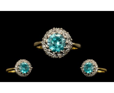 18ct Gold - Attractive Diamond and Blue Topaz Set Cluster Ring. Flower head Design. Full Hallmark for 18ct. Blue Topaz of Exc