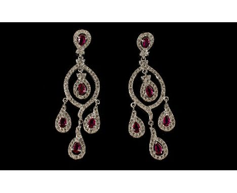 Faux Ruby and Diamond Chandelier Earrings, the pear cut faux rubies being the feature stones on a framework set with round cu