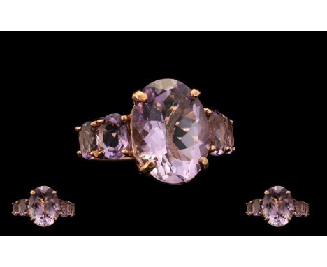 Rose de France Amethyst Statement Ring, an 8.5ct oval cut Rose de France amethyst with further oval cuts of .75ct and .5ct se