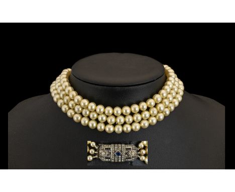 Art Deco Pearl Choker. Triple strand pearl choker / necklace with silver gem set clasp, please see accompanying image.