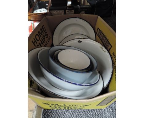 A collection of vintage enamel bowls and plates.