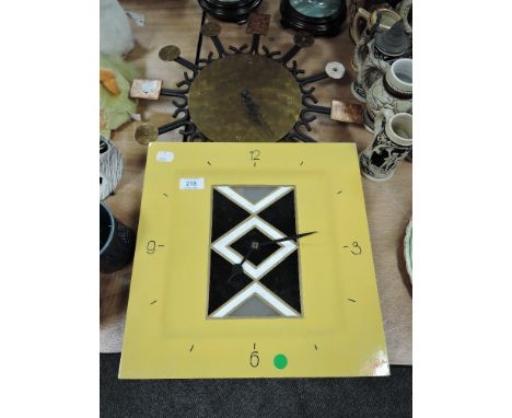 Two vintage clocks having minimalist styling.