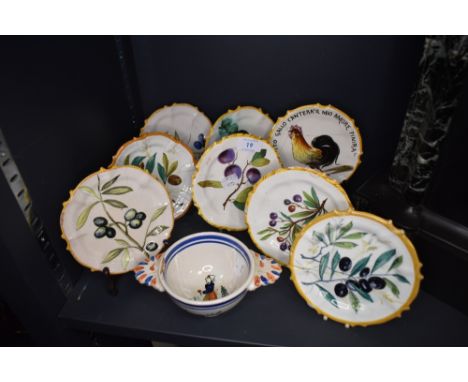 A selection of hand decorated continental plates and Quimper porringer