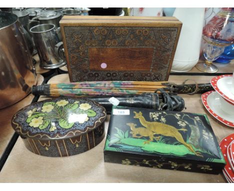 Two vintage cooperative biscuit tins, an early 20th century brass framed telescopic umbrella, a parasol and a carved box.