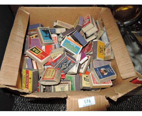 A box full of vintage collectable matchboxes.