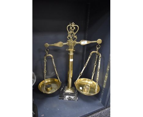 A set of antique apothecary or shop scales having brass cast frame on marble base