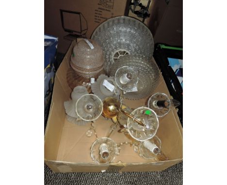 A collection of vintage glass light shades and a ceiling light.