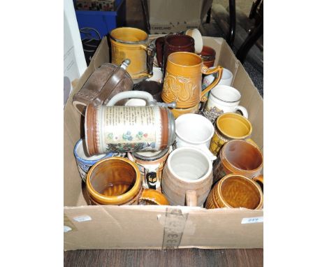 A box full of vintage ceramic tankards,mugs and steins.