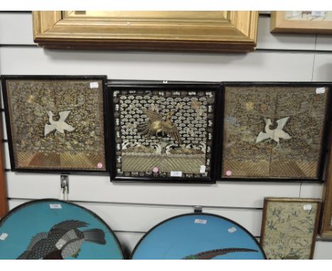 A set of three Chinese silk panels showing phoenix over ocean and night sky, central panel of similar imagery with elaborate 