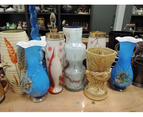 An assortment of vintage glass and ceramic vases,predominantly mid century.