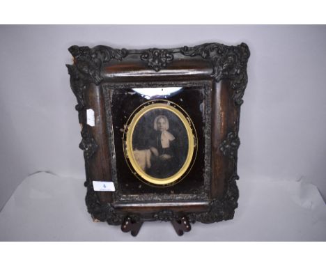 A Victorian portrait in a very ornate frame, dimentions 29cm x 26cm overall, oval portrait 12cm x 9cm.