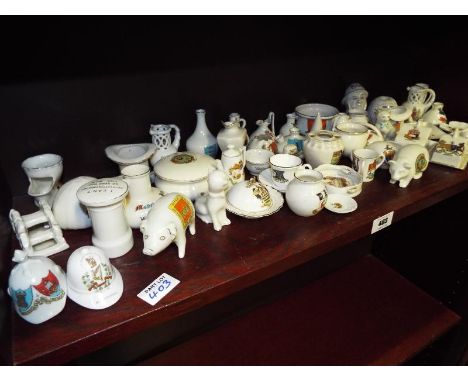 A large quantity of crested ware by Goss, Arcadian and Carlton China (qty)