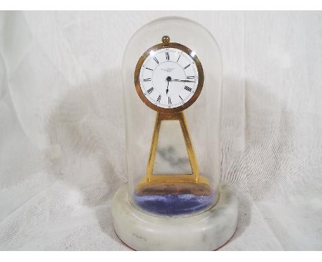 An unusual mantel timepiece by J.J.Bentley of Liverpool, pocket watch type movement in a gilded case on a marble base with gl