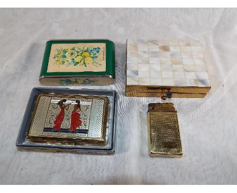 A vintage BSB musical powder compact with original box, a Dandy-Mate Sylvia musical compact, a Volupte compact cigarette and 