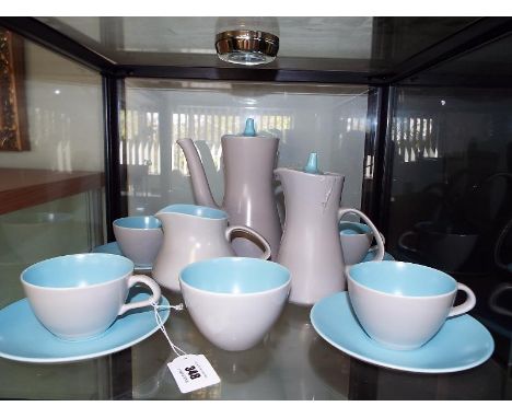 A 14 piece Poole Pottery tea service decorated in an aqua and mushroom ground, marked to the base, circa 197015