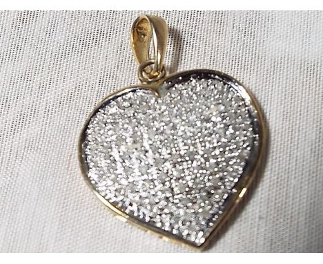 A lady's stone encrusted heart shaped pendant with gold mounts stamped 9k. with 1 k diamonds