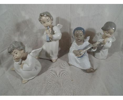 Four Lladro figurines depicting cherubs