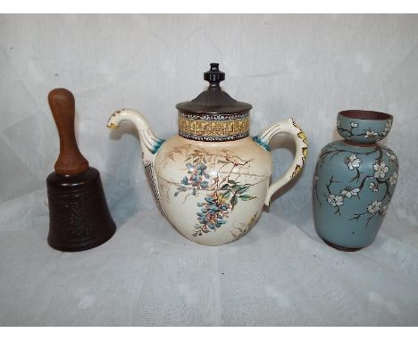 An unusual Doultons Burslem ware ceramic teapot, 23 cm (high) with maker's marks to the base with white metal lid and Bakelit