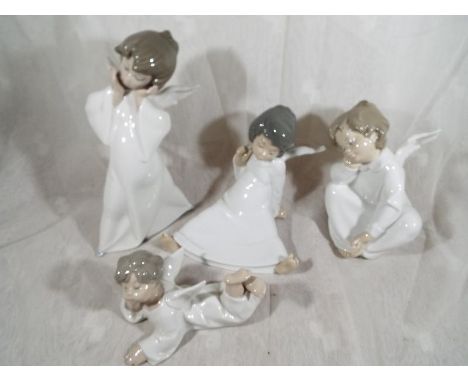 Four Lladro figurines depicting cherubs