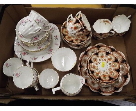 A ceramic tea service decorated in the New Chelsea pattern, approximately 20 pieces and a further tea service by M&S, decorat