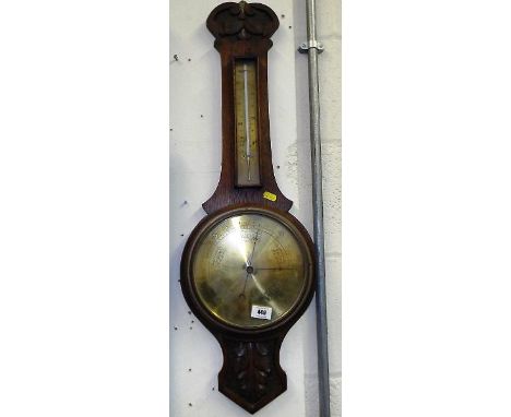 A wall mounted Arts and Craft style aneroid barometer, engraved brass dial and thermometer scale Est £20 - £30