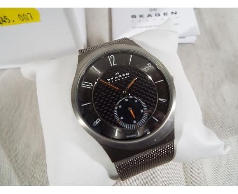 A gentleman's wristwatch by Skagen of Denmark, slim titanium case and close woven band, unused in box with paper Est £60 - £8