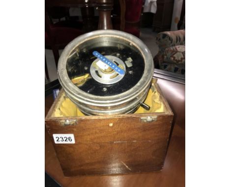A vintage pigeon clock in a wooden box  