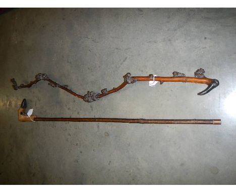 A walking stick with horn handle and one other.  Collect only.  