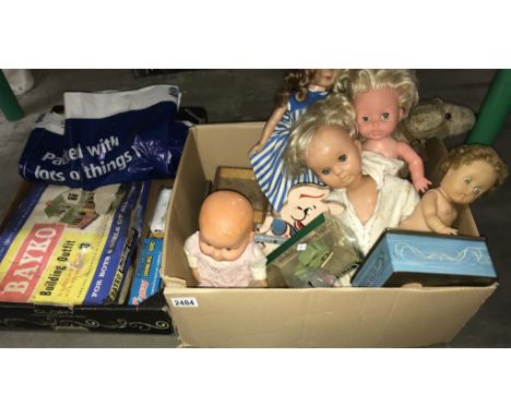A box of vintage dolls and wooden building blocks. Part Bayko set etc.  