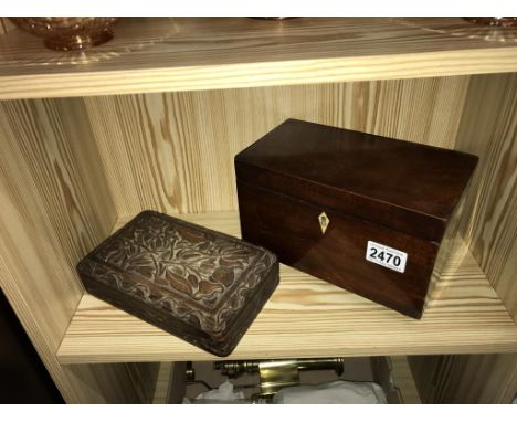 A Victorian mahogany tea caddy on brass ball feet and a carved cigarette box  