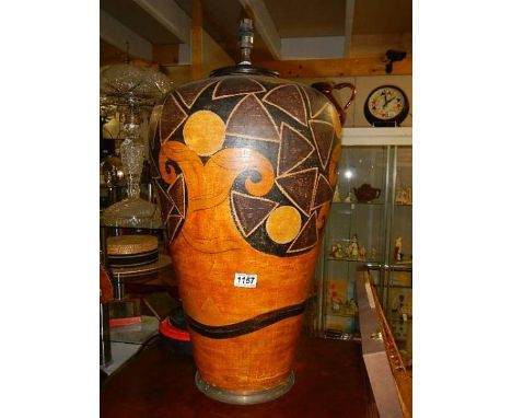 A large floor standing ceramic lamp in Egyptian style.  