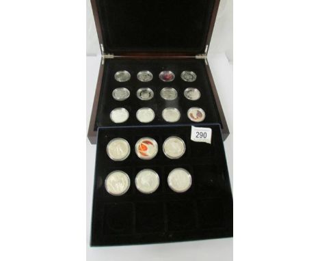 A collection of eighteen 2003 silver Lord of the Rings coins.