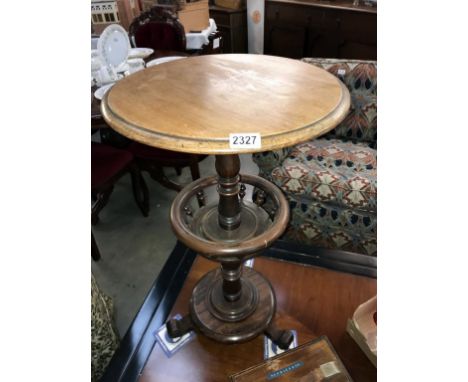 A victorian mahogany tea/wine table on centre column with spindled shelf Height 71cm x 42cm  