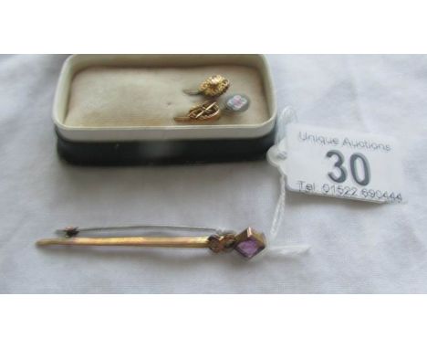 Three antique stick pins and a brooch including gold examples.  