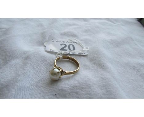 A 14k gold ring set single pearl, size N.  