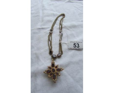 An Victorian gold necklace set rubies and seed pearls. Weight 34.8g, length and width of pendant 4.5cm x 4cm, approx. look li
