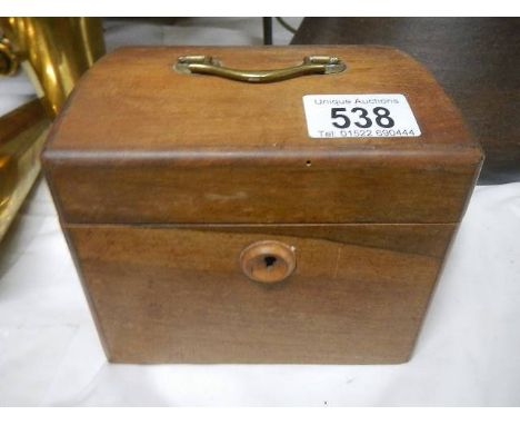 A Victorian mahogany tea caddy.